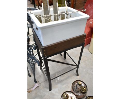 A vintage belfast style sink, with measure/feeder attachment, on bespoke wood and cast stand, approx. 45 x 37cm