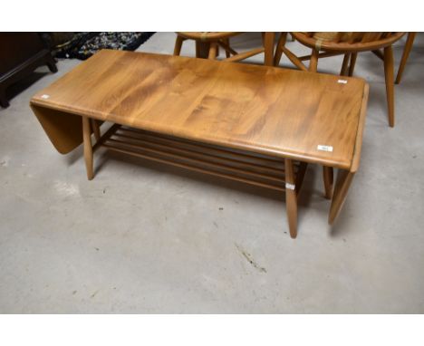 A vintage Ercol coffee table having drop ends and railed undertier, approx. 108 x 44cm
Condition report: Two ring marks and a
