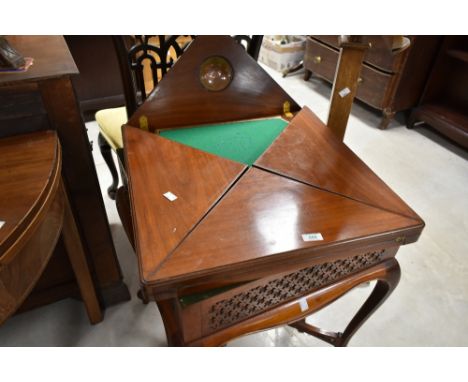 A 19th Century mahogany envelope card table, having blind fret frieze and drawer , on shaped legs width approx. 54cm