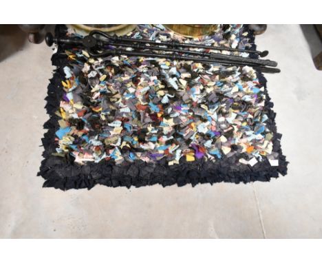 A vintage pegged rag rug, approx. 97 x 67cm