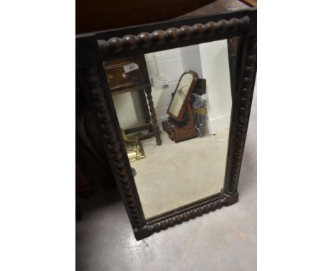A 19th Century wall mirror having bobbin turned style decoration to frame, approx. 82 x 51cm