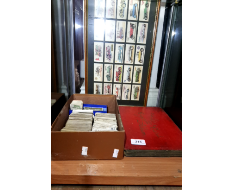 A SHELF OF CIGARETTE CARDS