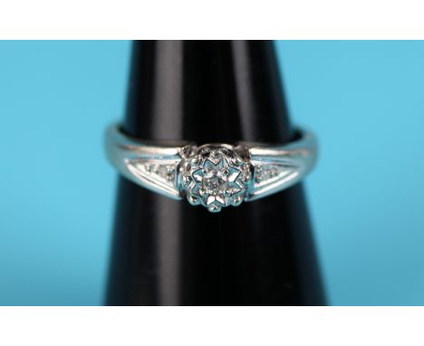 White gold diamond solitaire ring with diamond shoulders