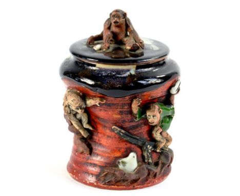 A JAPANESE SUMIDA WARE TOBACCO JAR AND COVER WITH SEATED MONKEY FINIAL, 15CM H, EARLY 20TH C