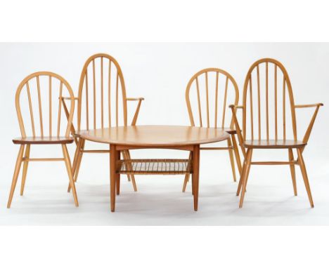 A SET OF FOUR ERCOL BEECH STICK BACK CHAIRS AND A SIMILAR LOW ROUND TABLE, 100CM DIAM