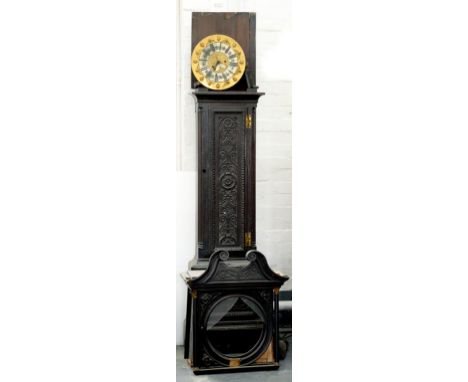 A LATE VICTORIAN CARVED AND DARK STAINED OAK EIGHT DAY LONGCASE CLOCK, WITH ROUND BRASS DIAL, THE CASE WITH SWAN NECK PEDIMEN