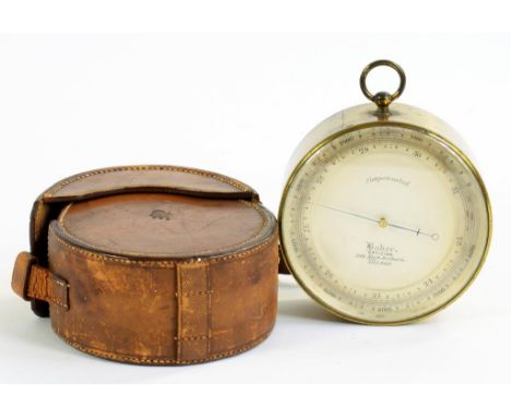 A  LACQUERED BRASS DRUM CASED ANEROID BAROMETER WITH FINE BLUED STEEL NEEDLES AND SILVERED DIAL WITH VERNIER INSCRIBED BAKER 