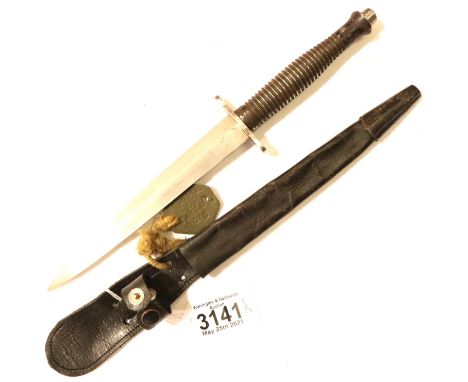 Fairbairn and Sykes commando knife and leather scabbard, WWII period with dogtag. P&amp;P Group 2 (£18+VAT for the first lot 