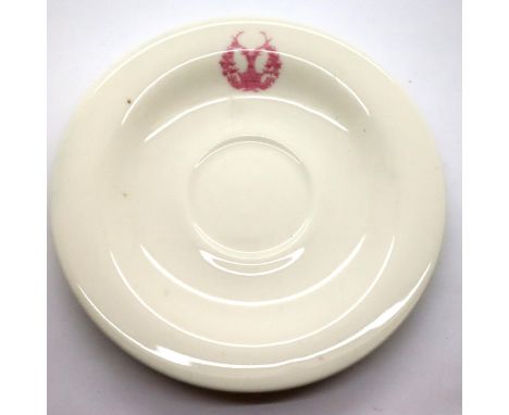 The Gordon Highlanders, a ceramic saucer with the Highlanders badge printed to the rim, marked verso (indistinct), D: 16 cm. 