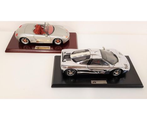 TWO DIE CAST 1:18 SCALE MODEL VEHICLEScomprising a Porche Boxter and a McLaren F1 1993 sports car, both with stands and boxes