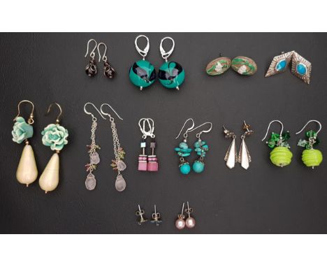 TWELVE PAIRS OF SILVER MOUNTED EARRINGSof various designs and sizes, including pearl, enamel, turquoise, mother of pearl, mar