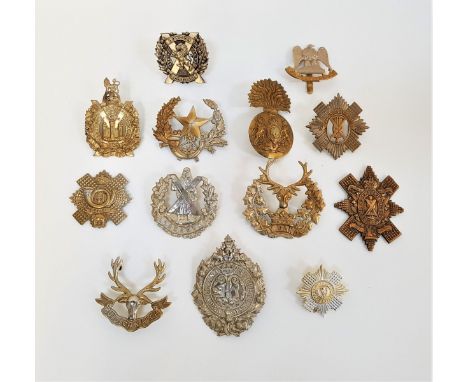 SELECTION OF MILITARY CAP BADGESincluding the Queens Own Cameron Highlanders, Kings Own Scottish Borderers, Highland Light In