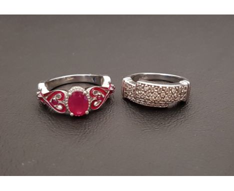 TWO GEM SET SILVER RINGScomprising a pave set diamond ring, and ruby and red enamel ring, ring sizes N-O and P respectively (