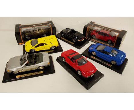 SEVEN MAISTO 1:18 SCALE DIECAST VEHICLEScomprising a Special Edition Jaguar XKR (1998), a Special Edition Volkswagen New Beet