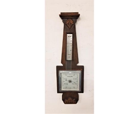 OAK CASED ANEROID BAROMETERwith a thermometer on a silverd scale above a square silvered dial, 57.5cm high 