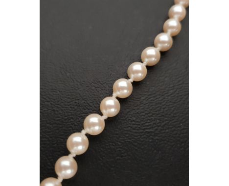 CULTURED PEARL NECKLACEthe pearls individually knotted, with nine carat gold clasp, 69cm long 