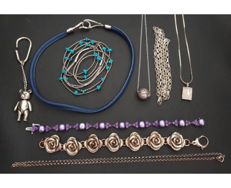 SELECTION OF SILVER AND SILVER MOUNTED JEWELLERY including a rose link bracelet, a leather necklace with silver clasp, a pear