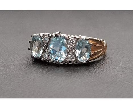 AQUAMARINE AND DIAMOND THREE STONE RING the three graduated oval cut aquamarines measuring approximately 0.75cts in the centr