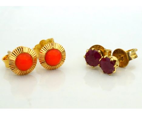 TWO PAIRS OF STUD EARRINGScomprising coral in eighteen carat gold and ruby in fourteen carat gold