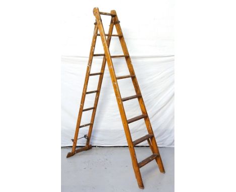 SET OF VINTAGE PINE EXTENDING STEP LADDERSstencilled 'The Patent Safety Ladder Company's Patent X', with eight flat steps (19