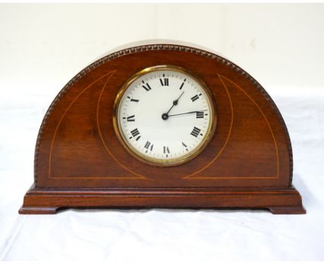 EDWARDIAN MAHOGANY MANTEL CLOCKwith shaped body, black Roman numerals on white enamel dial, French movement, 26.8cm wide
