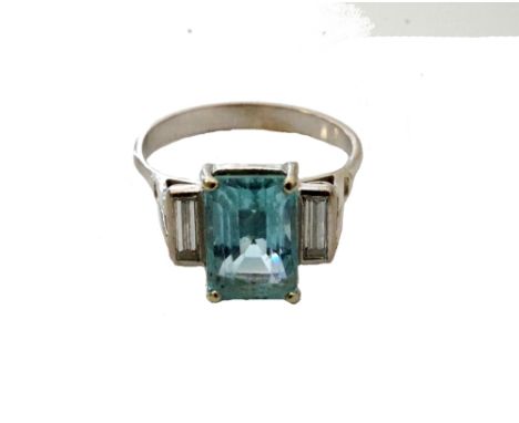 AQUAMARINE AND DIAMOND RINGthe central emerald cut aquamarine approximately 2.2cts, flanked by a baguette cut diamonds to eac