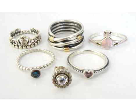 FOUR PANDORA SILVER RINGSincluding three gem set examples; a pink enamel decorated Vivienne Westwood silver ring; and a singl