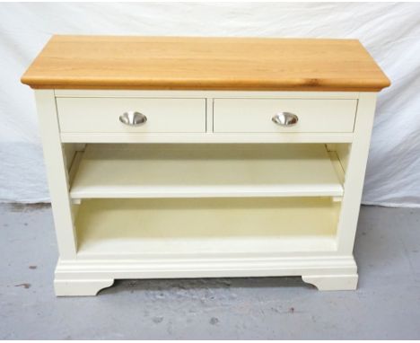 LIGHT OAK AND PAINTED SIDE TABLEthe moulded top above two frieze drawers with an open adjustable shelf below, standing on bra