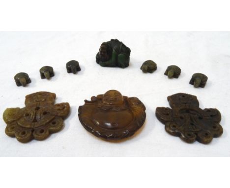 CARVED HARDSTONE BUDDAH PENDANTof circular form, the reverse carved with a lotus flower, 5.5cm diameter; two carved and pierc