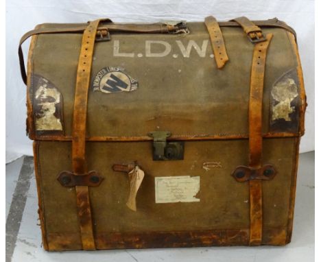 LARGE DOMED TOP CANVAS AND LEATHER BOUND TRAVEL TRUNKearly 20th century, the lined interior with button-back detail to inner 
