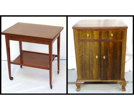 MAHOGANY BEDSIDE CHESTwith two short drawers above a double door cupboard base with shelved interior, raised on short shaped 