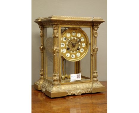 Late 19th century French gilt metal four glass mantel clock, circular dial with inset numerals, twin train movement stamped 5