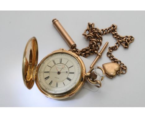 An 18ct Gold button wind Chronograph with centre seconds and attched 15ctchain with 9ct Gold fobs