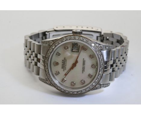 A brilliant ladies Rolex oyster perpetual midi chronometer wristwatch with magnified date aperture, the pearl face enhanced b