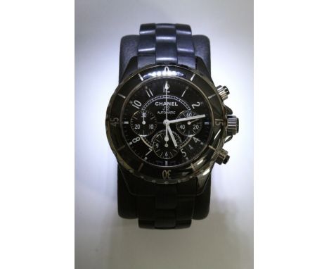 A quality gents Chanel J-12 automatic chronograph wristwatch with black ceramic strap to match the black face and bezel, in o