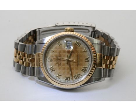 A gents Rolex oyster perpetual chronometer wristwatch with magnified date aperture with gold tone bezel and two tone strap