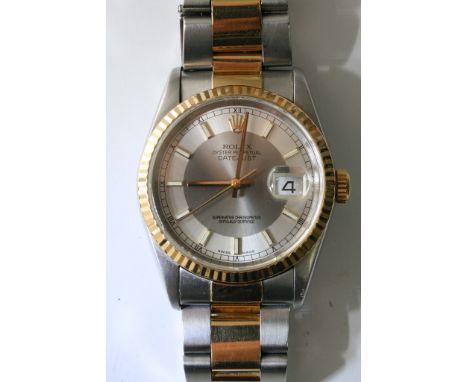 A gents automatic Rolex Oyster Perpetual datejust superlative chronometer wristwatch with hourly batons, a gold tone bezel an