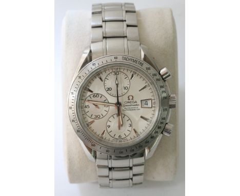 A boxed Omega Speedmaster automatic chronometer wristwatch with three subsidiary dials and date aperture presented alongside 