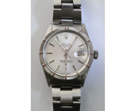 A gents Rolex oyster perpetual chronometer wristwatch with batons replacing numerals and a magnified date aperture set on a c