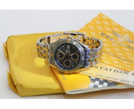 A gents 18ct gold and stainless steel Breitling chronometer automatic wristwatch with date aperture and three subsidiary dial