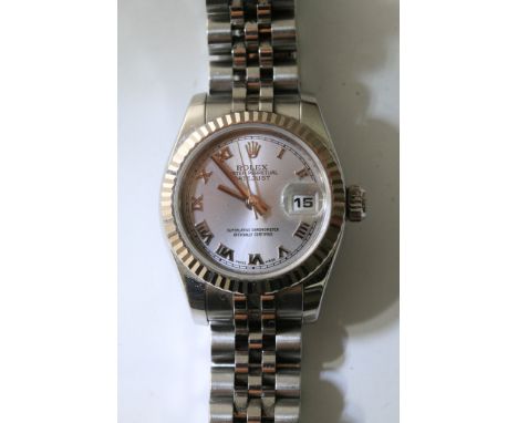 A ladies petite Rolex Oyster Perpetual datejust chronometer wristwatch with a magnified date aperture with a metallic face pr