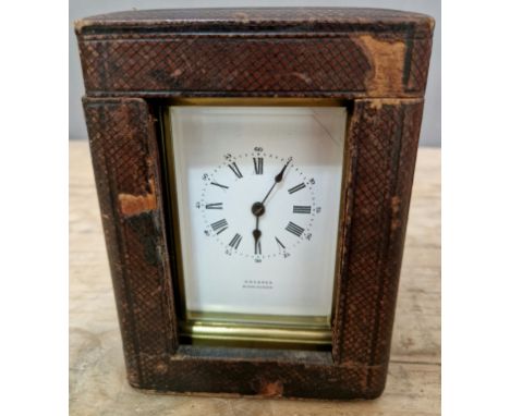 A French brass repeater carriage clock with leather case. 