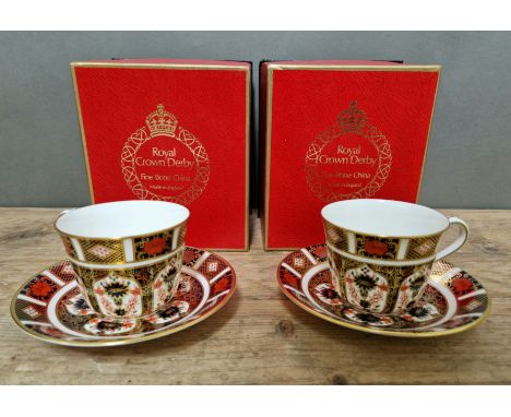 A set of two Royal Crown Derby 1128 Imari teacups and saucers, with boxes. 