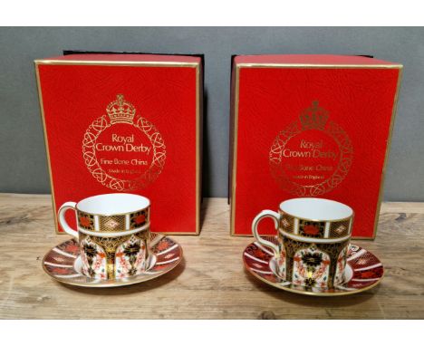 A set of two Royal Crown Derby 1128 Imari coffee cups and saucers, with boxes. 