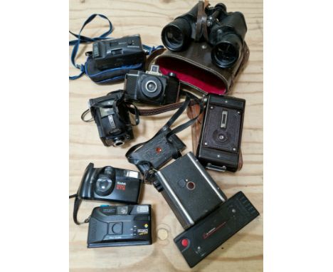 A box of vintage cameras to include a Soho Cadet folding camera, a Coronet Twelve-20 box camera, a Autograph, Kodak, a pair o
