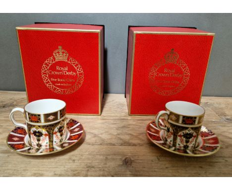 A set of two Royal Crown Derby 1128 Imari coffee cups and saucers, with boxes. 