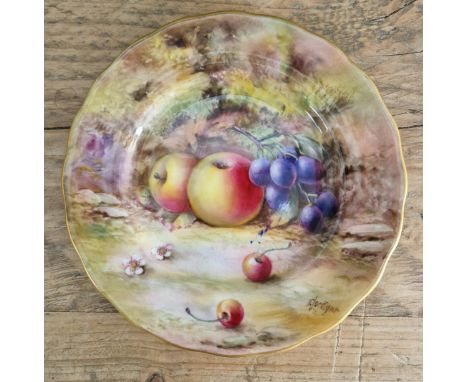 A Royal Worcester plate, 16cm diameter, decorated with fruit to a mossy background.Condition:- Crazing throughout, no sign of