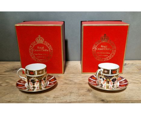 A set of two Royal Crown Derby 1128 Imari coffee cups and saucers, with boxes. 