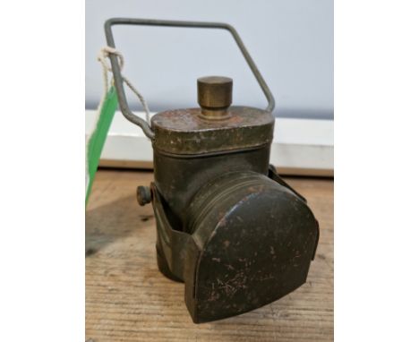 A war time issue battery bicycle lamp with hooded beam and  army green paintwork, marked 'Lampelectric No1, E R Co Ltd' to ba