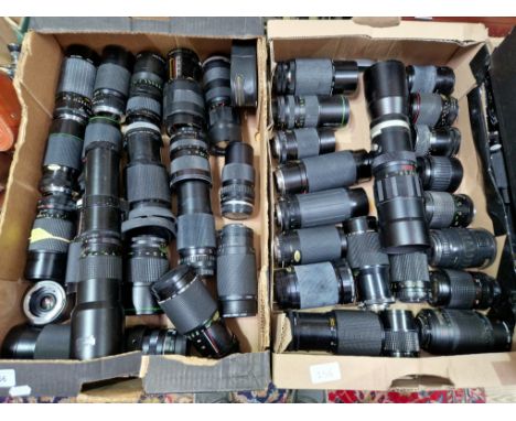 Two boxes of various camera lenses to include Soligor, Hanimex, macro, etc. 